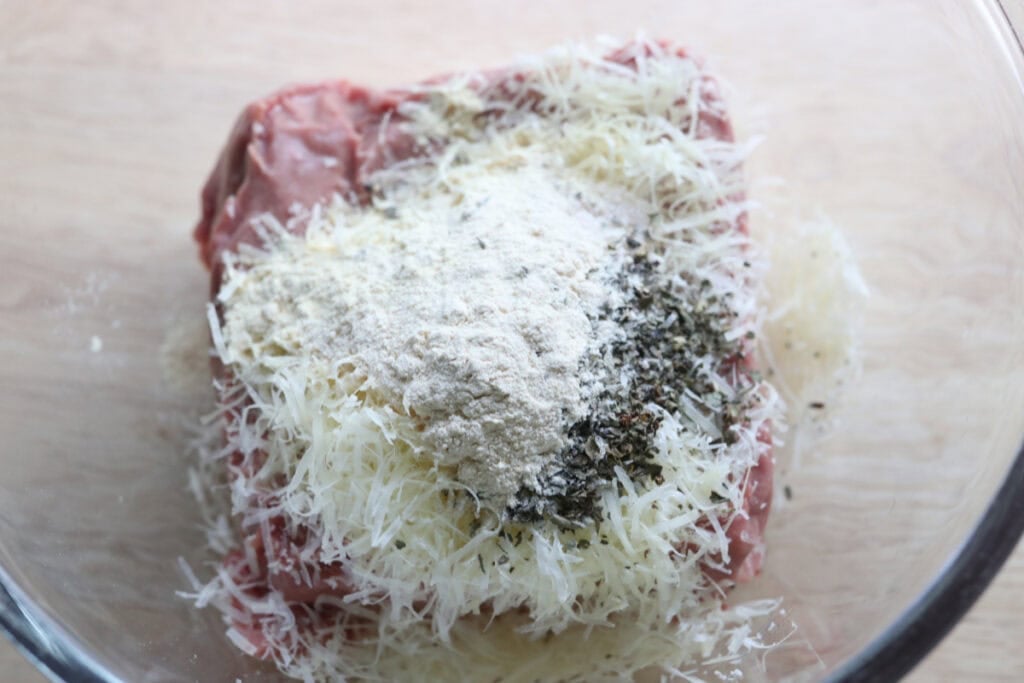 ingredients for the crust in a bowl to make high protein chicken crust chicken alfredo pizza