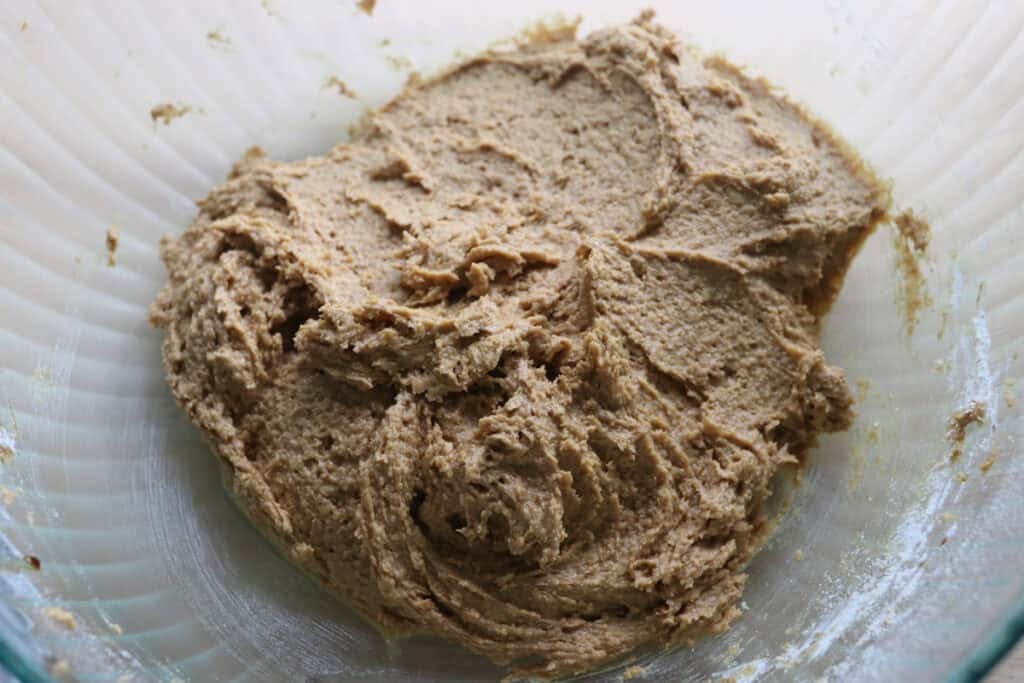Freshly milled tiramisu cookie batter in a glass bowl